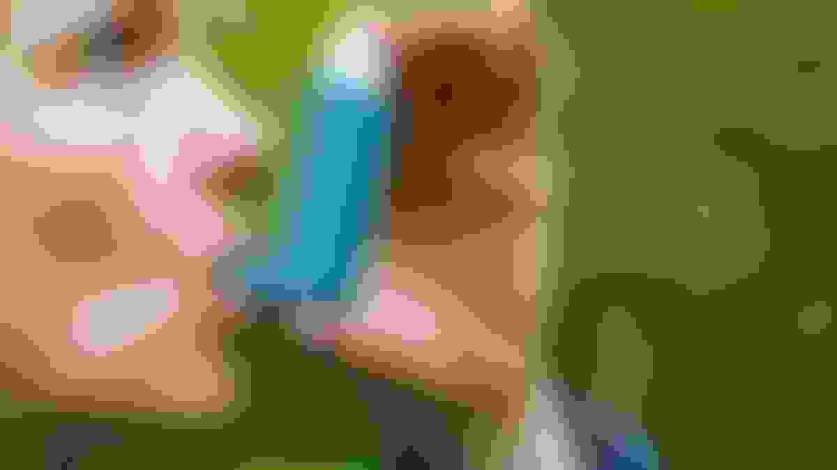 A woman with chronic obstructive pulmonary disease is using a blue inhaler.