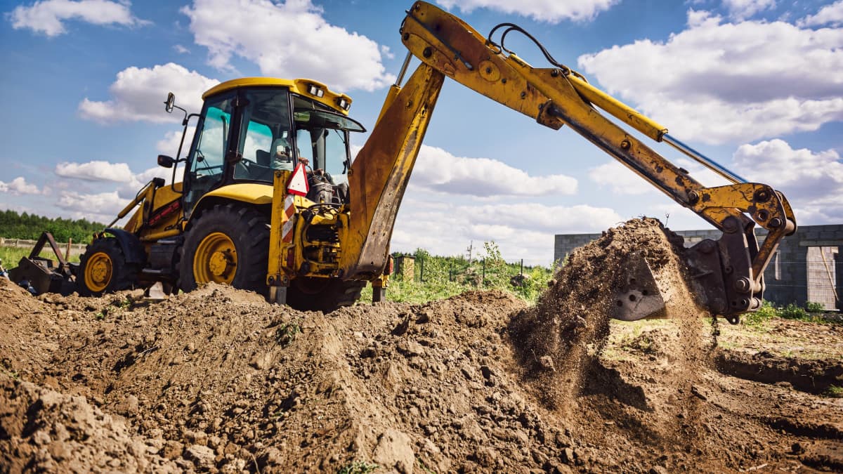 excavator working in a field