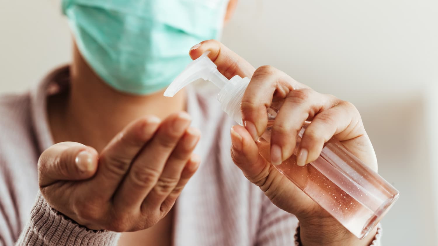 person washing their hands, possibly because they are immunocompromised