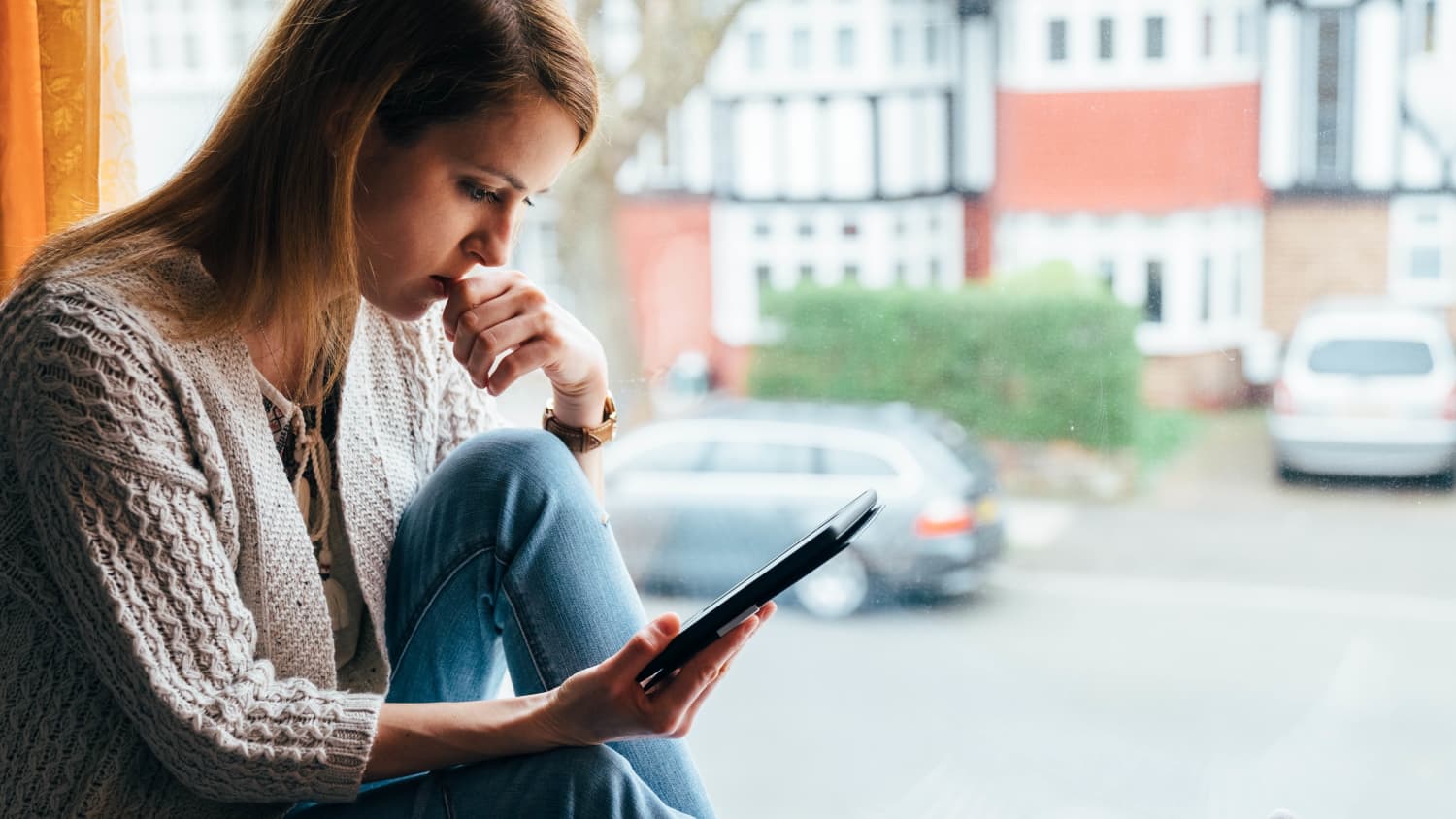 woman on phone concerned about omicron variant