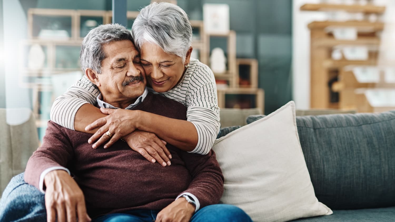 older couple on couch hugging after car t-cell therapy