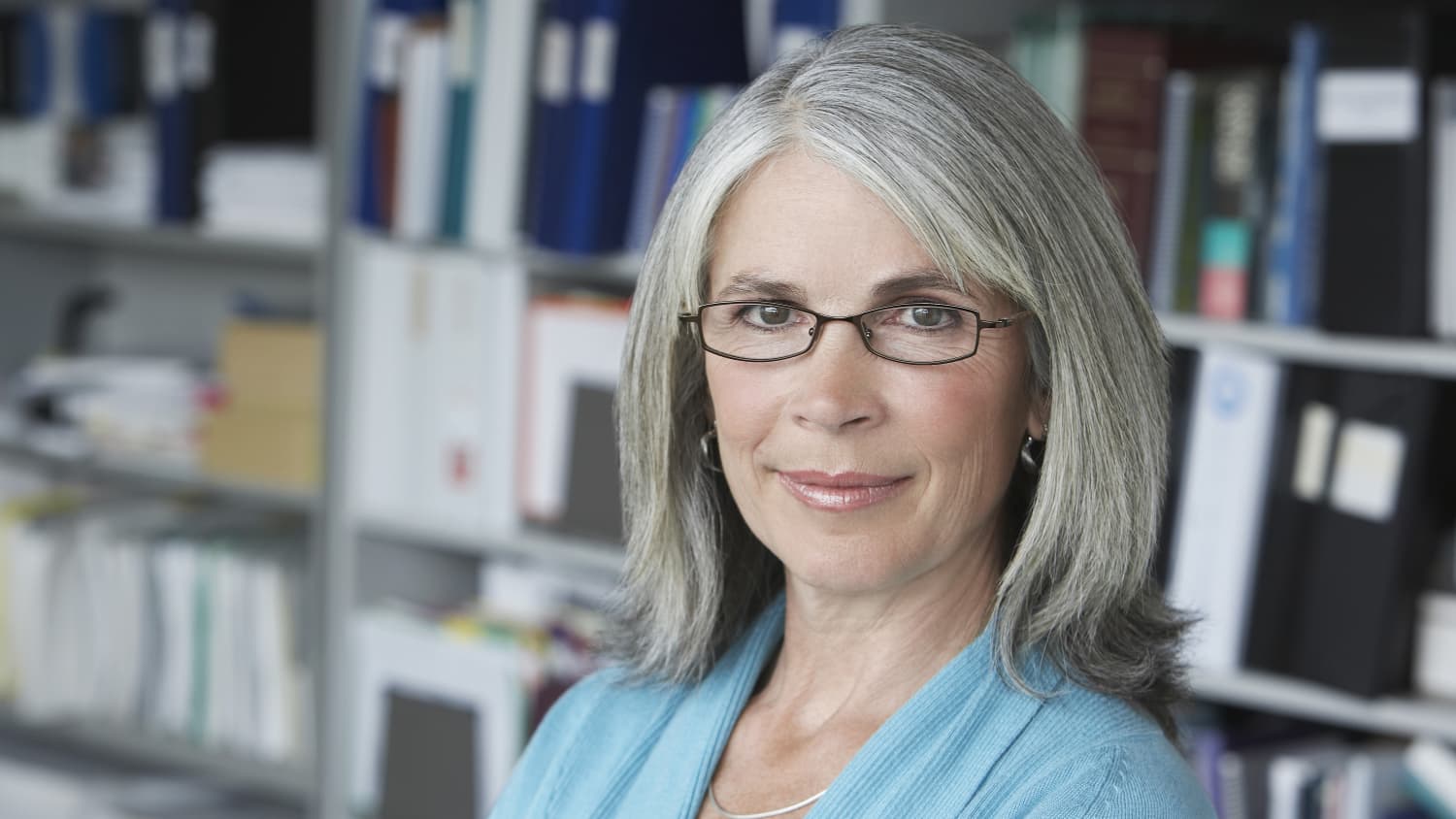 A mature woman, who possibly has retina detachment, looks into the camera.