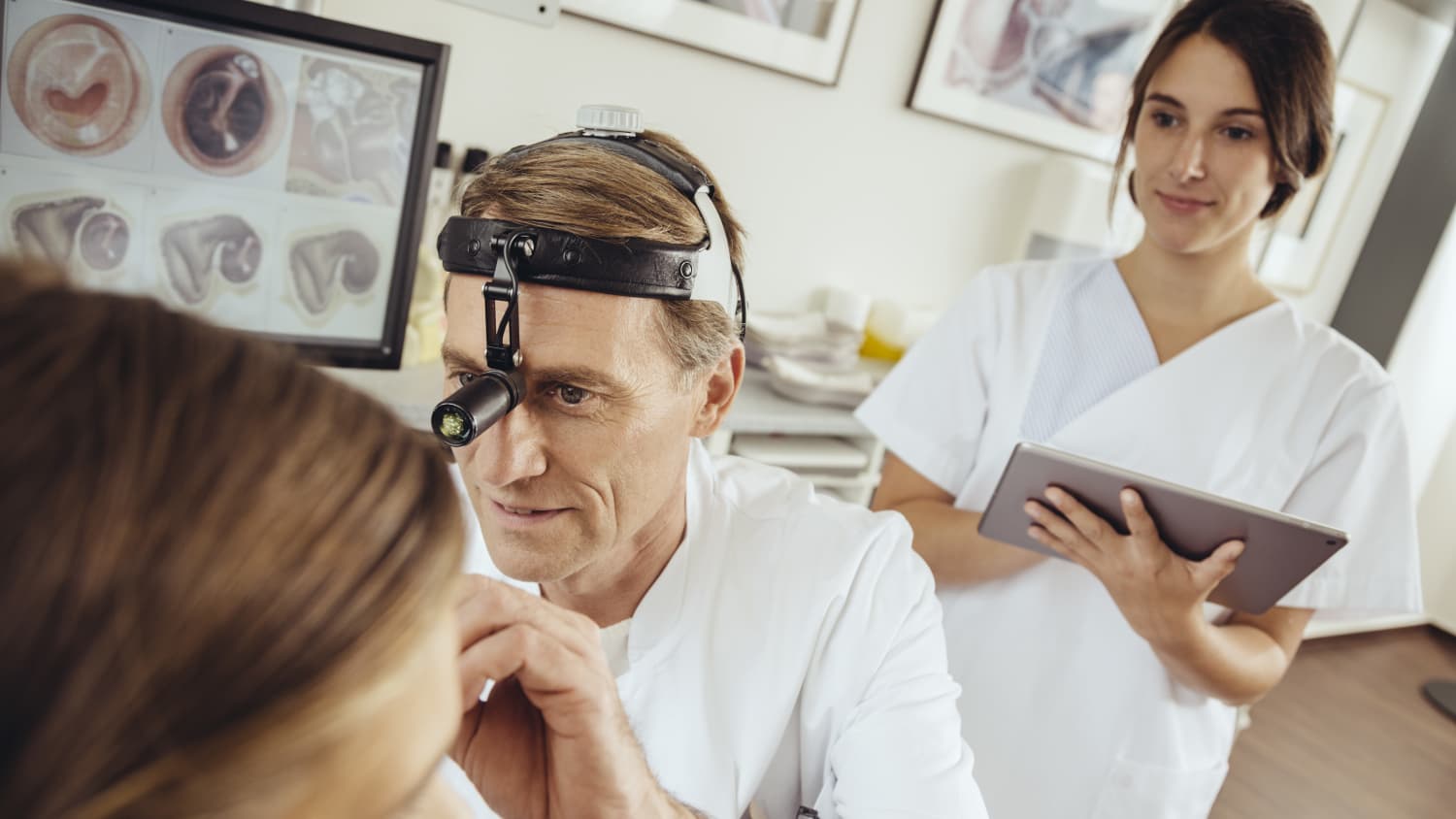 ENT Examines Woman's Ear