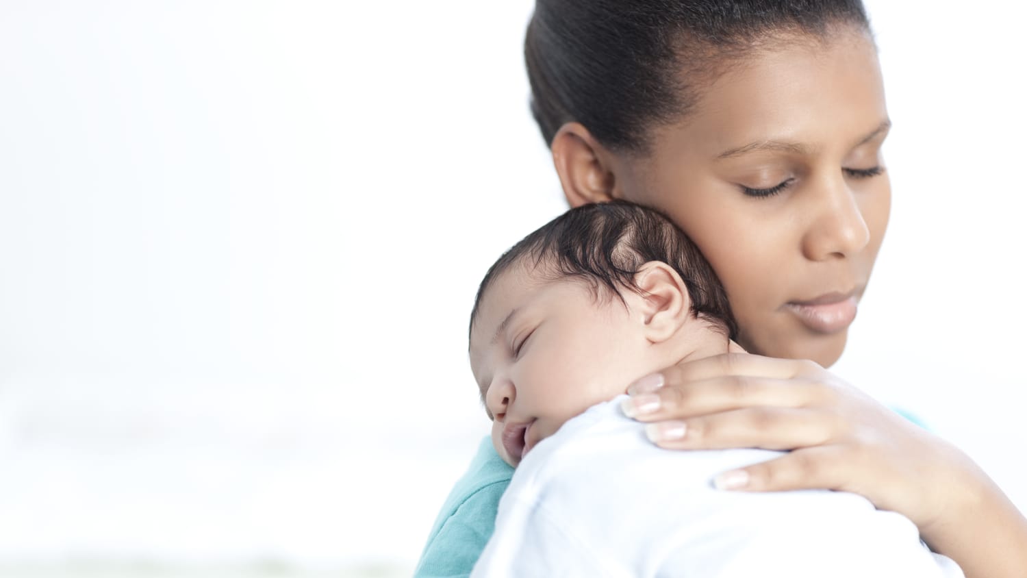 baby being held by its mother, perhaps in advance of congenital heart surgery