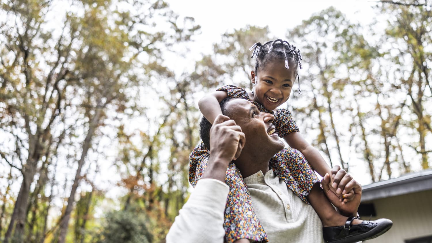 father and daughter walking in park after treatment for conduct disorder