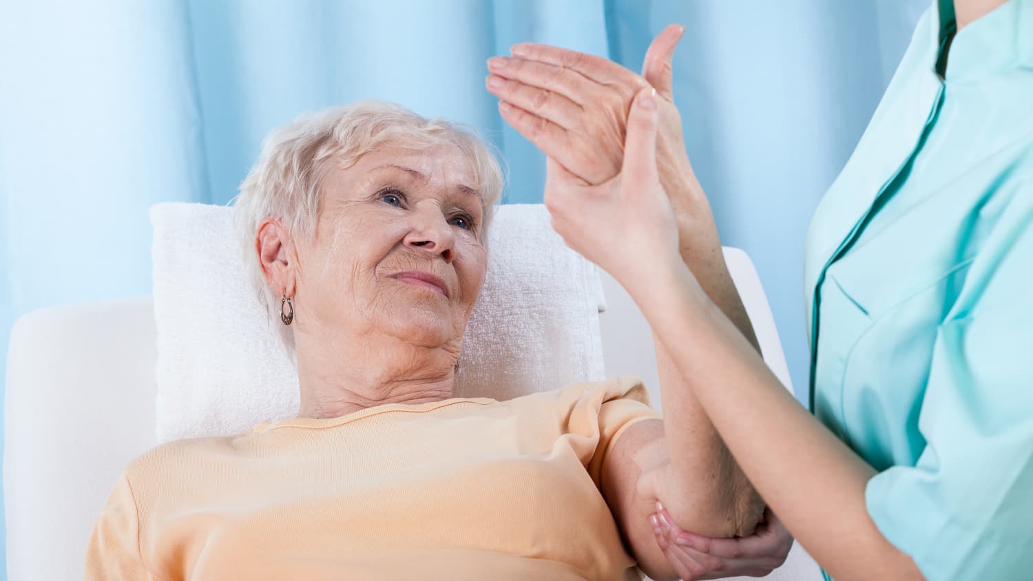 An older woman is checked for osteoporosis.