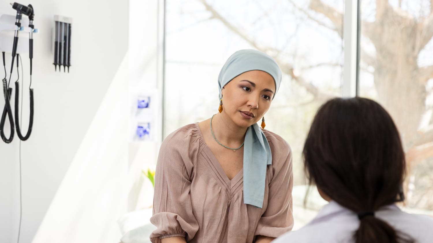 Young Woman with Cancer Talks to Doctor