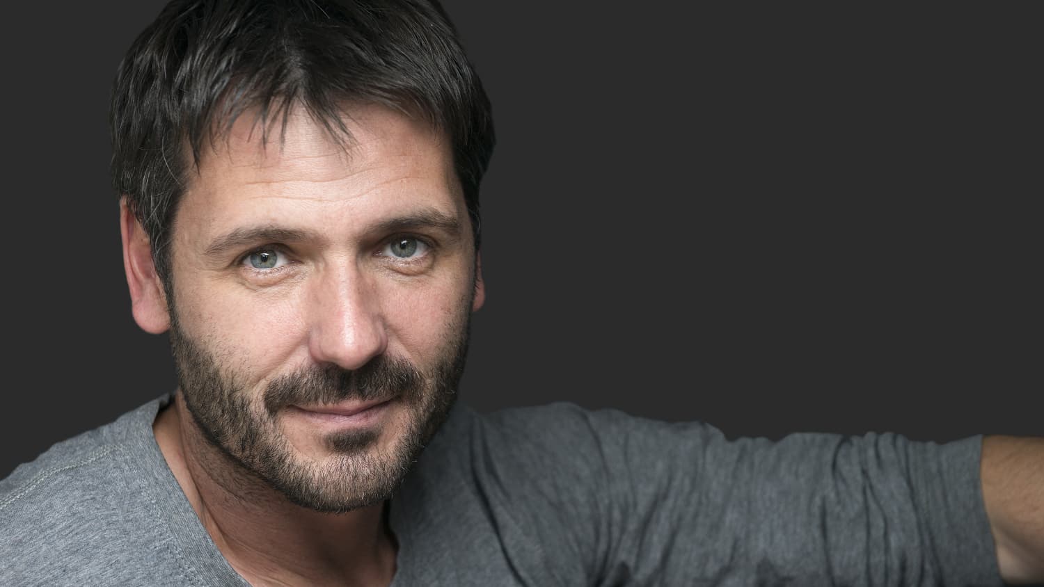 A man possibly with a stimulant use disorder looks at the camera.