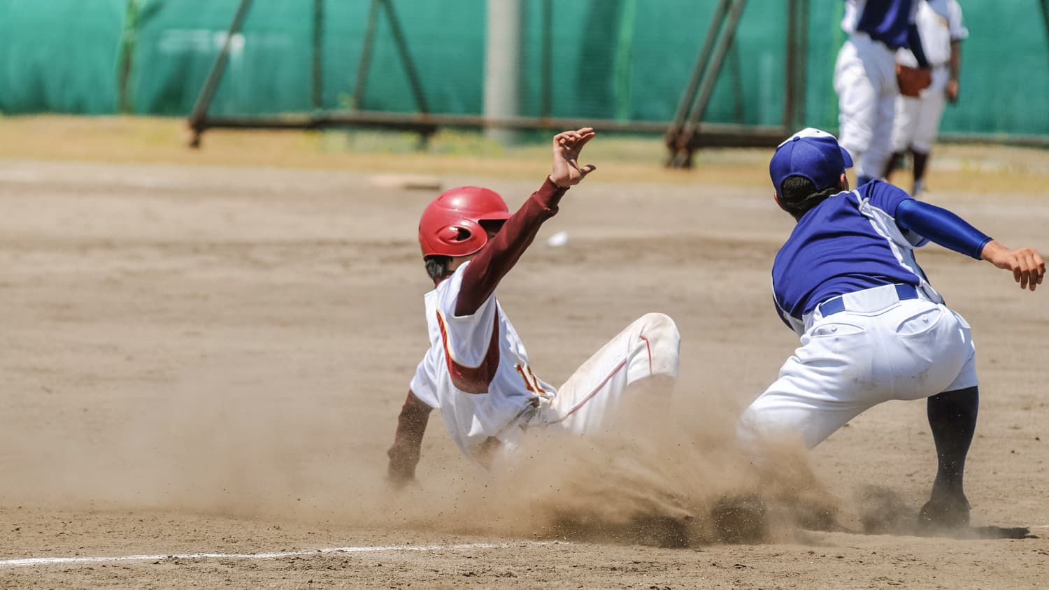 kid sliding into home base