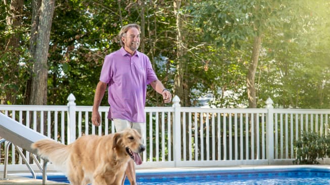 Jay Curran walking with his dog