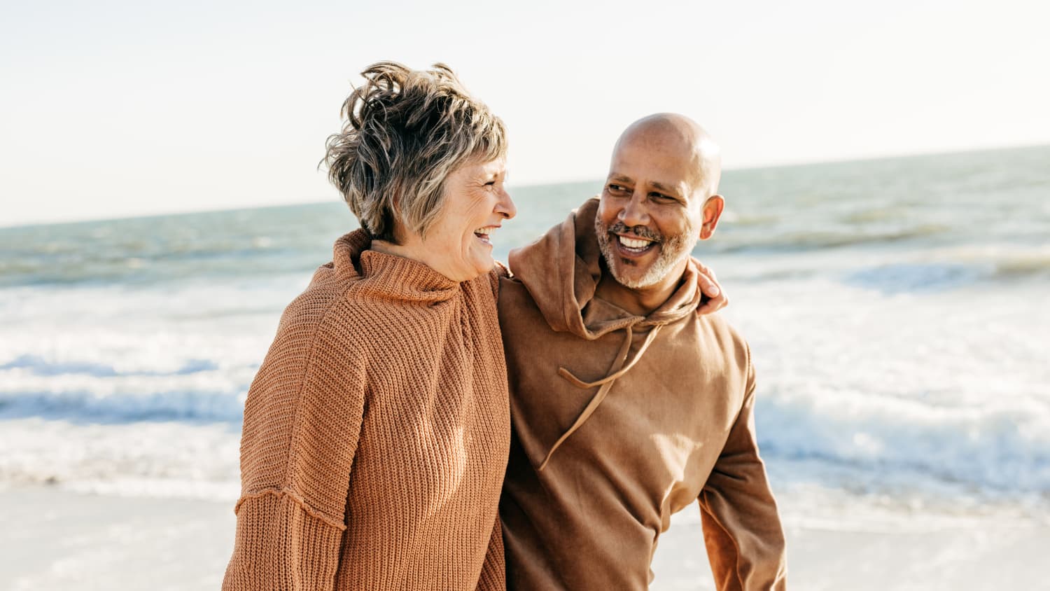 man with Femoroacetabular Impingement Syndrome walks on beach