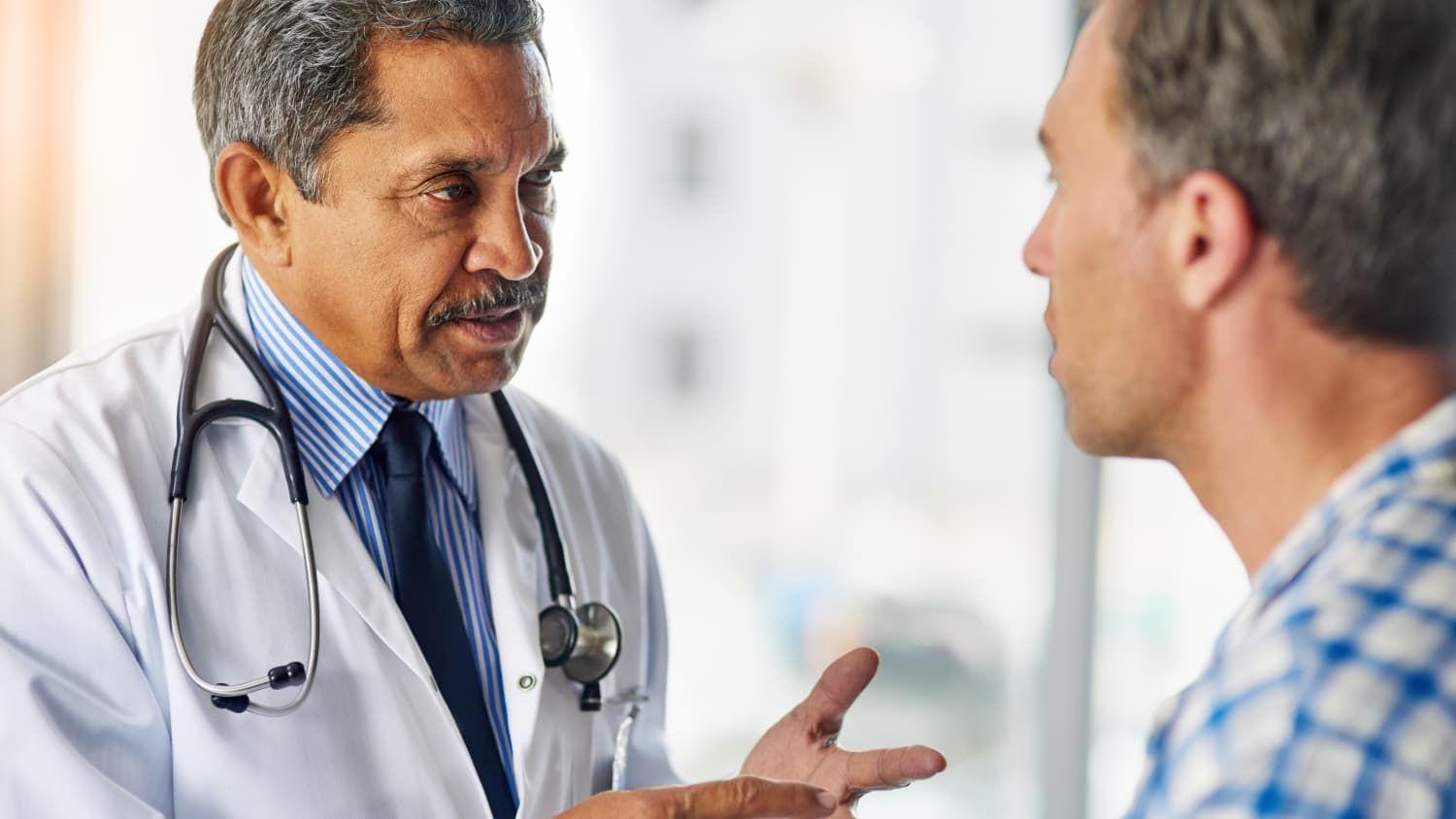 Doctor talking to his patient, possibly about erectile dysfunction