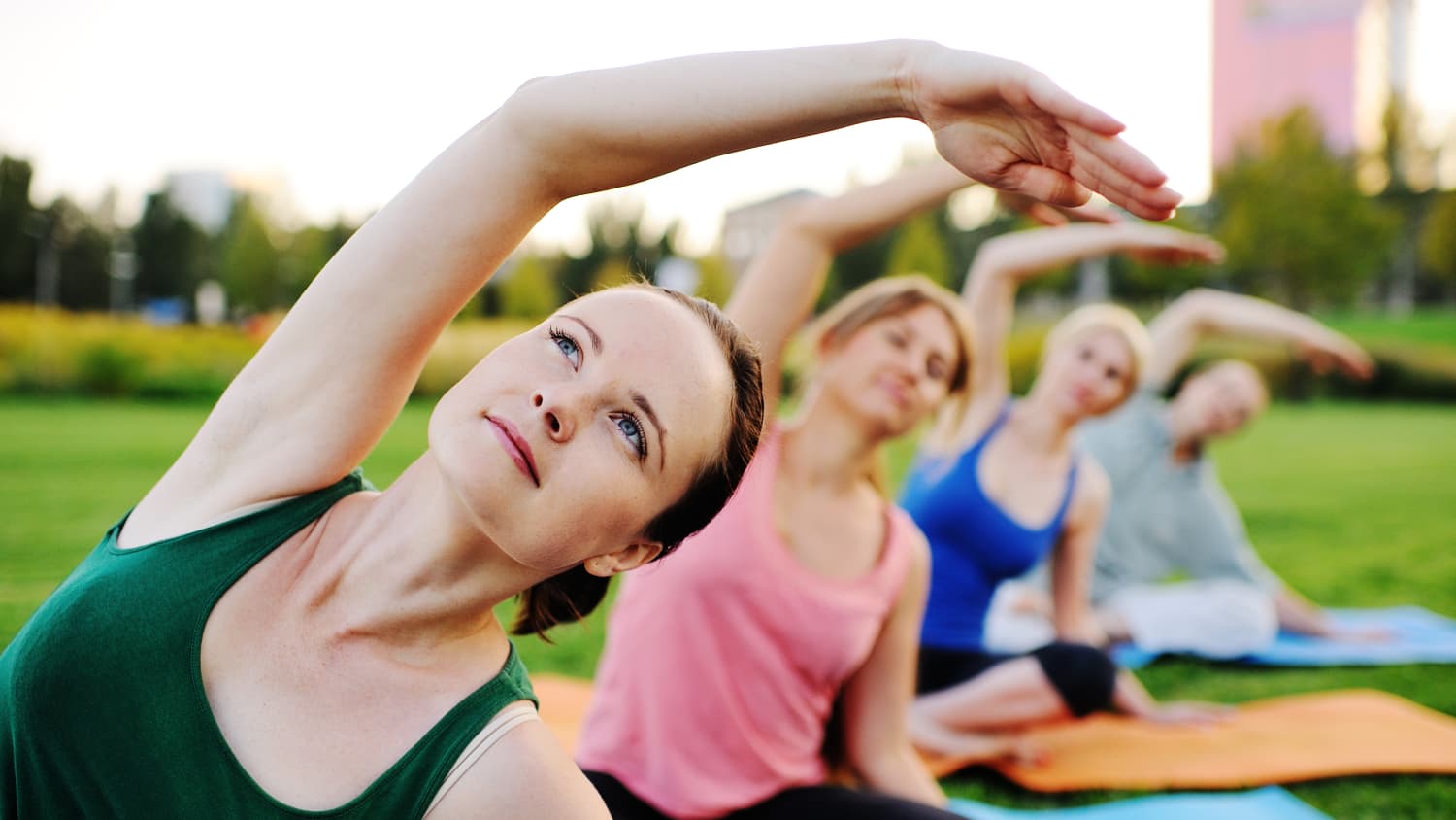 A young woman recovered from anesthesiology for heart bypass surgery practices yoga.