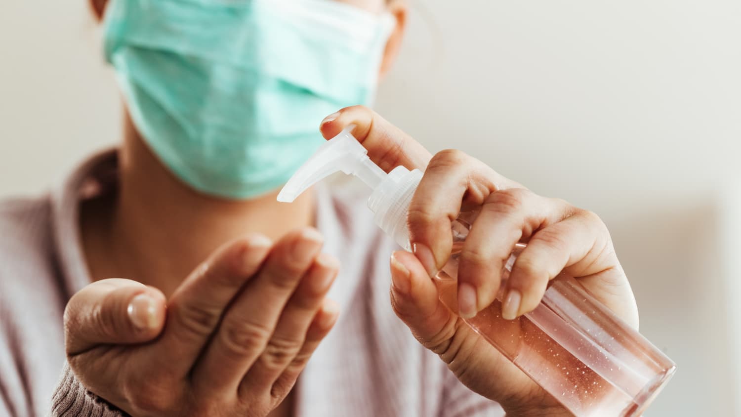 person washing their hands, possibly because they are immunocompromised