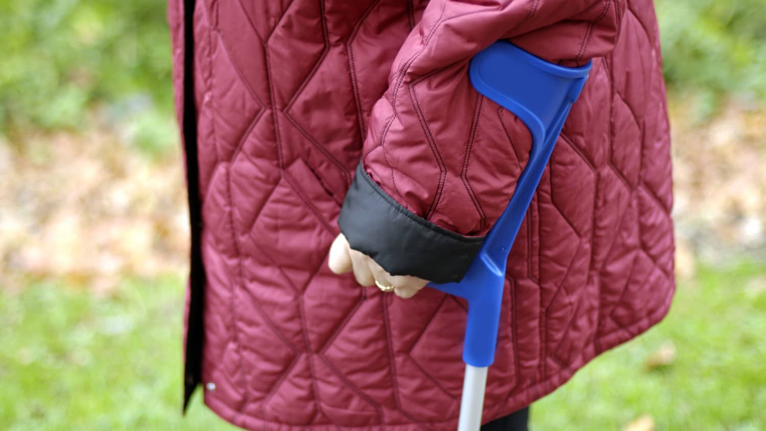 A closeup of a young hand gripping a walker, possibly because of muscular dystrophy