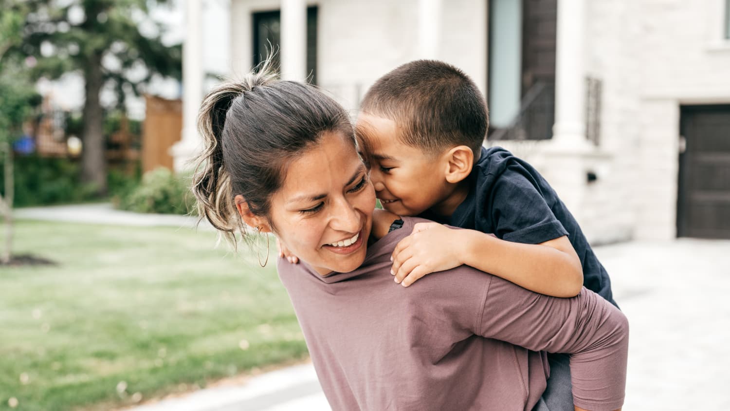 mother carrying her son after treatment for thoracic outlet syndrome