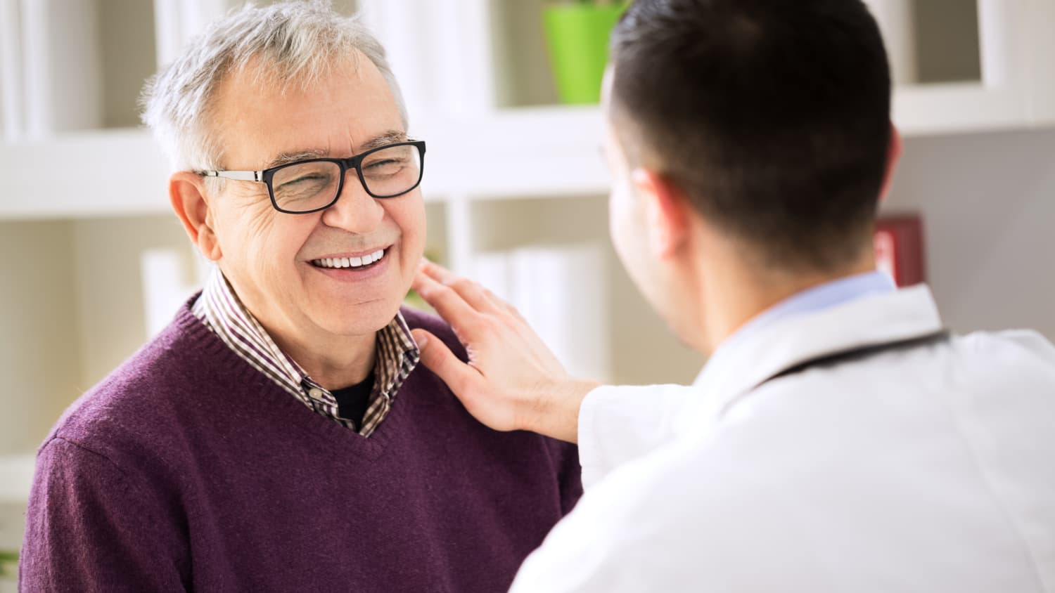 A patient possibly discussing prostatic artery embolisation with his doctor.