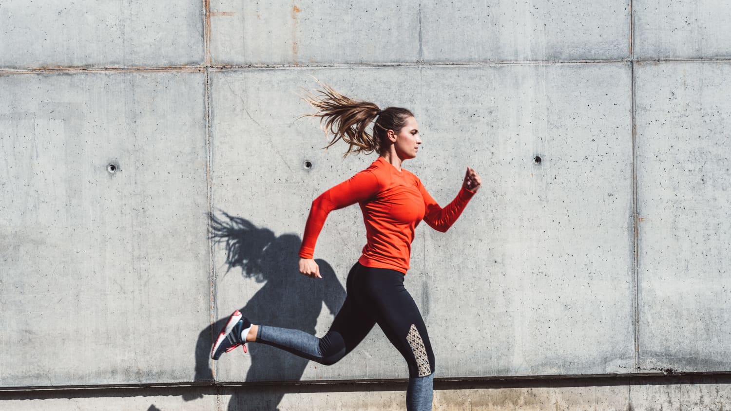 woman running after having breast reduction surgery