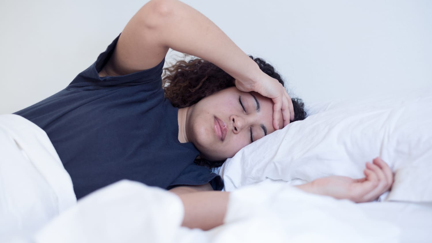 Woman in bed sick with pneumonia