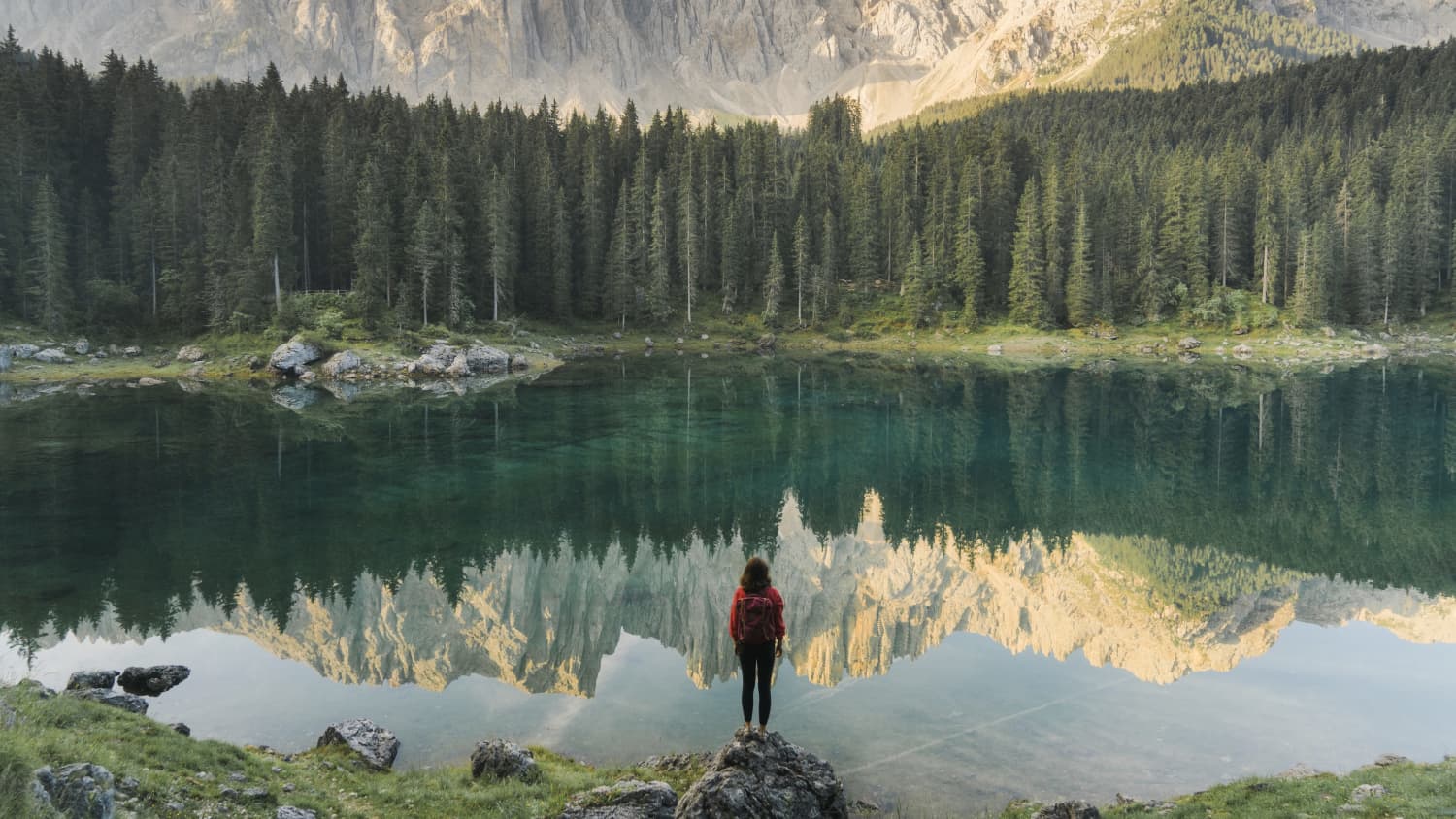 woman looking over a lake after radiation therapy