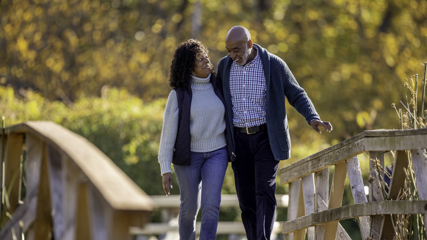 older couple walking in woods after AORIF procedure for bone metastases