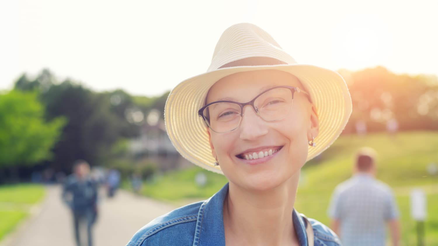 breast cancer survivor smiling while taking a walk