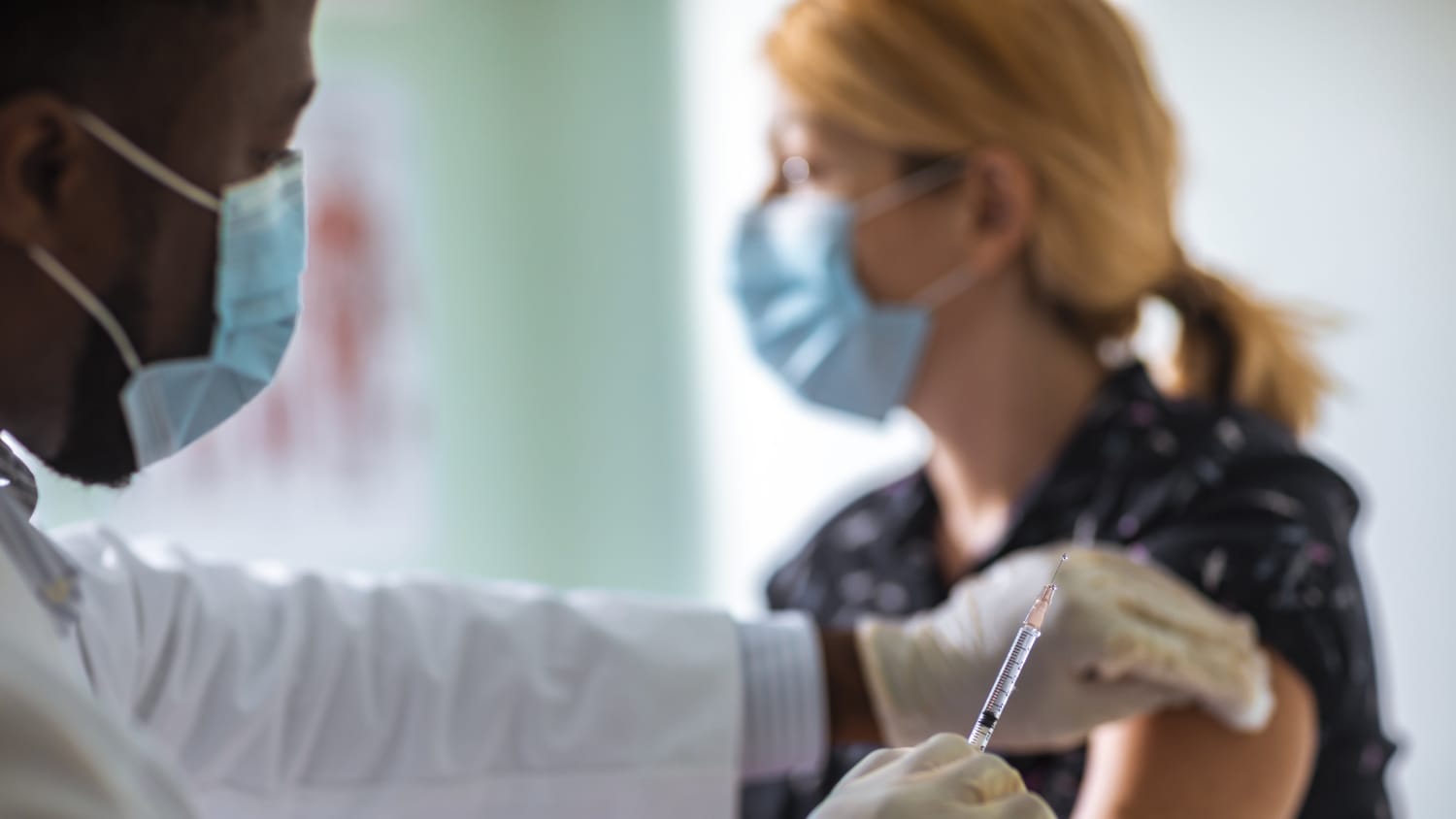 woman receiving a COVID-19 vaccine