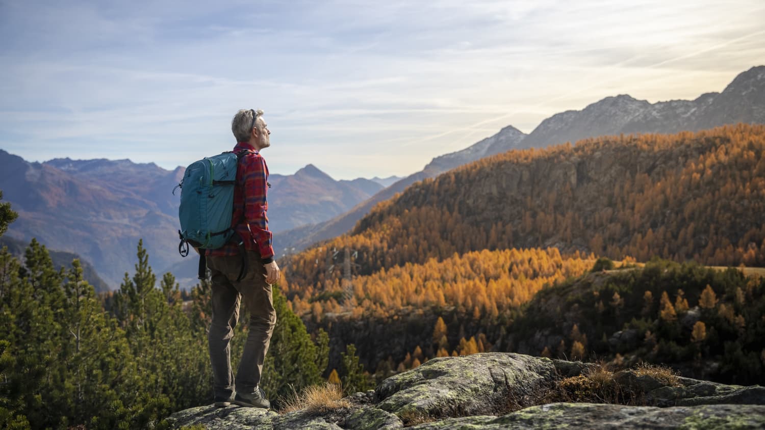 man with non-small cell lung cancer (NSCLC) hiking