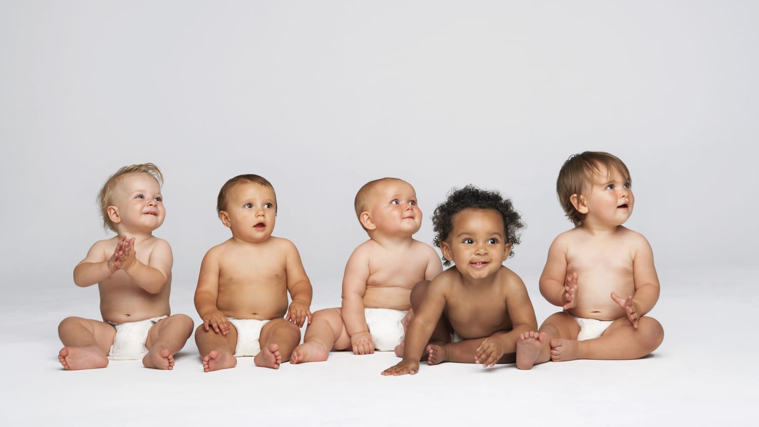 A group of babies, possibly born as the result of IVF, a successful infertility treatment