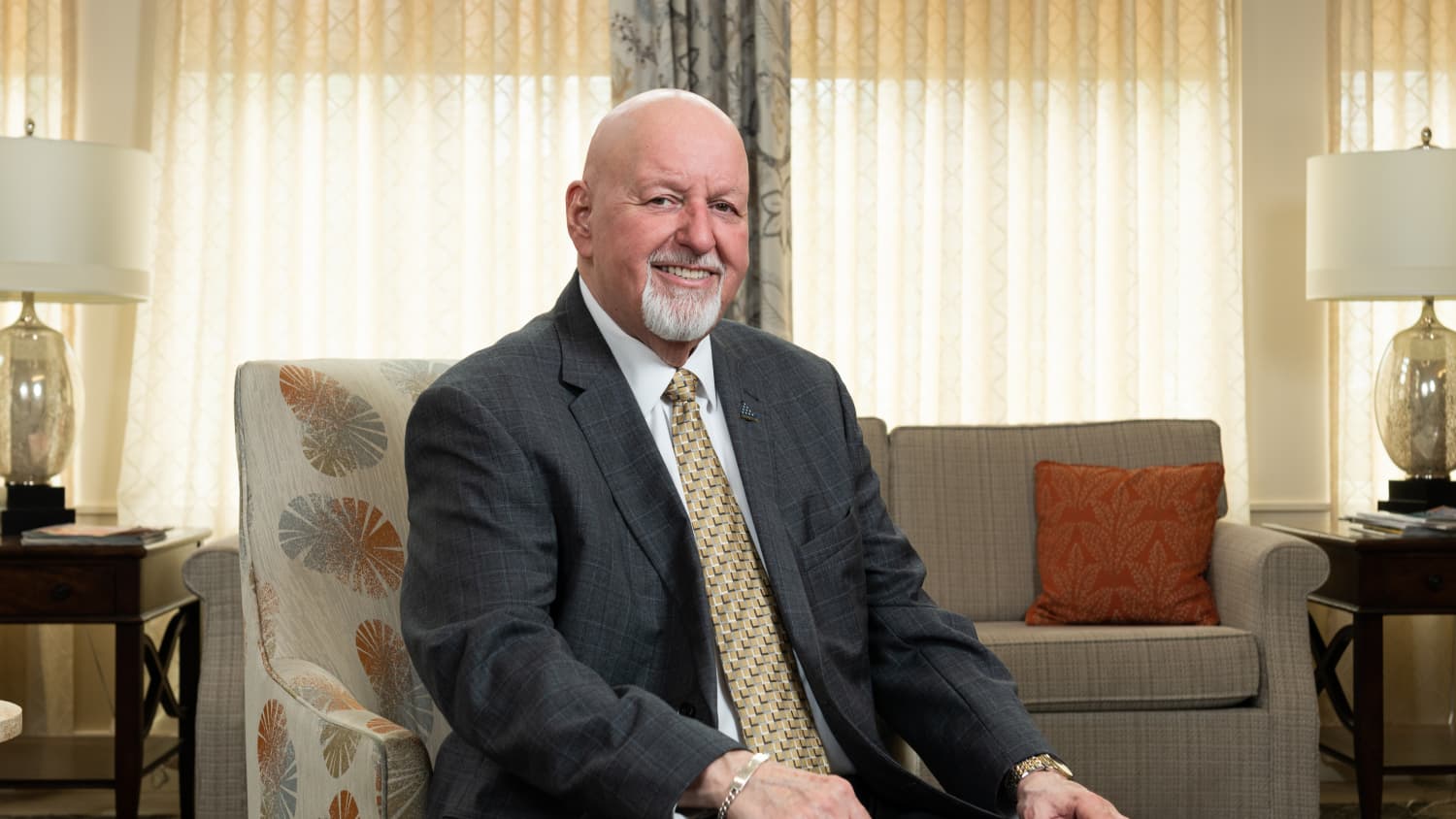 man sitting in a chair in an office