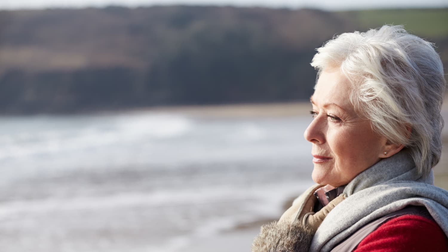 A woman with either pemphigus or pemphigoid, two blistering disorders, gazes into the distance.