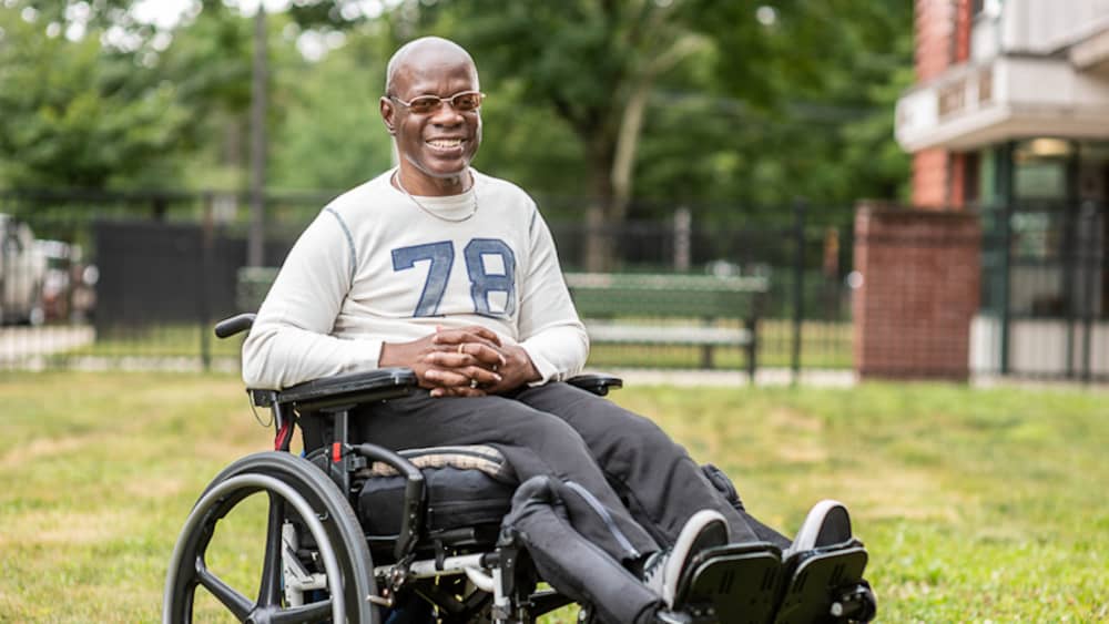 Rodney in wheelchair on grass.