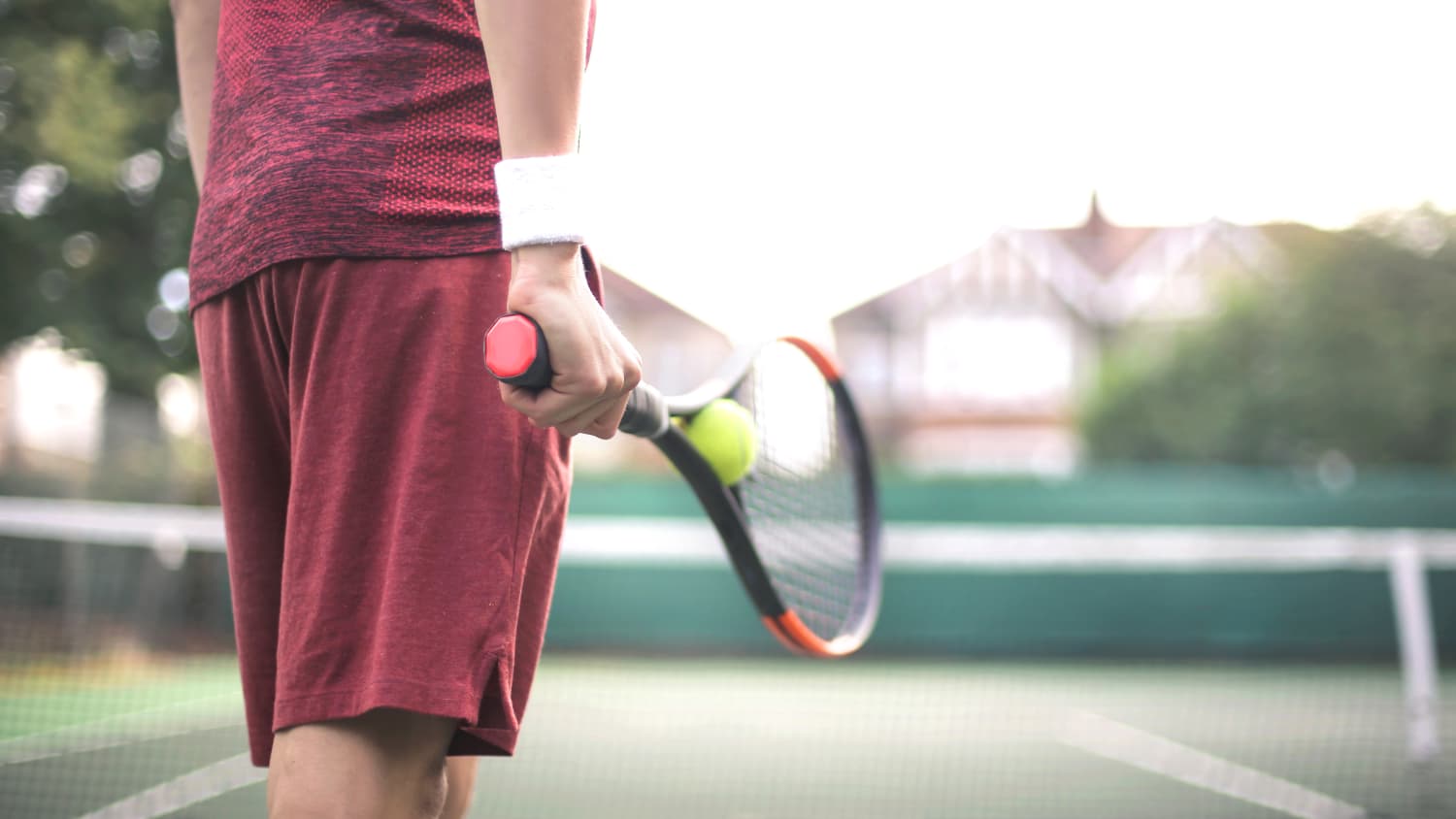 Sportive man playing a tennis match, possibly recovering from De Quervain's Tenosynovitis