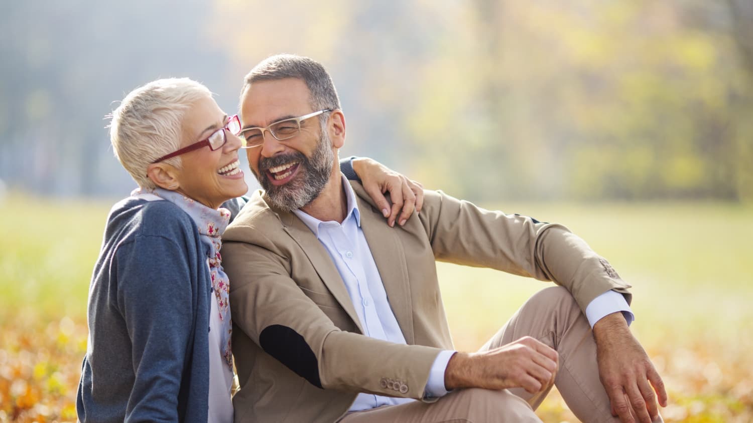 Middle aged couple in a park, enjoying renewed intimacy after a penile implant