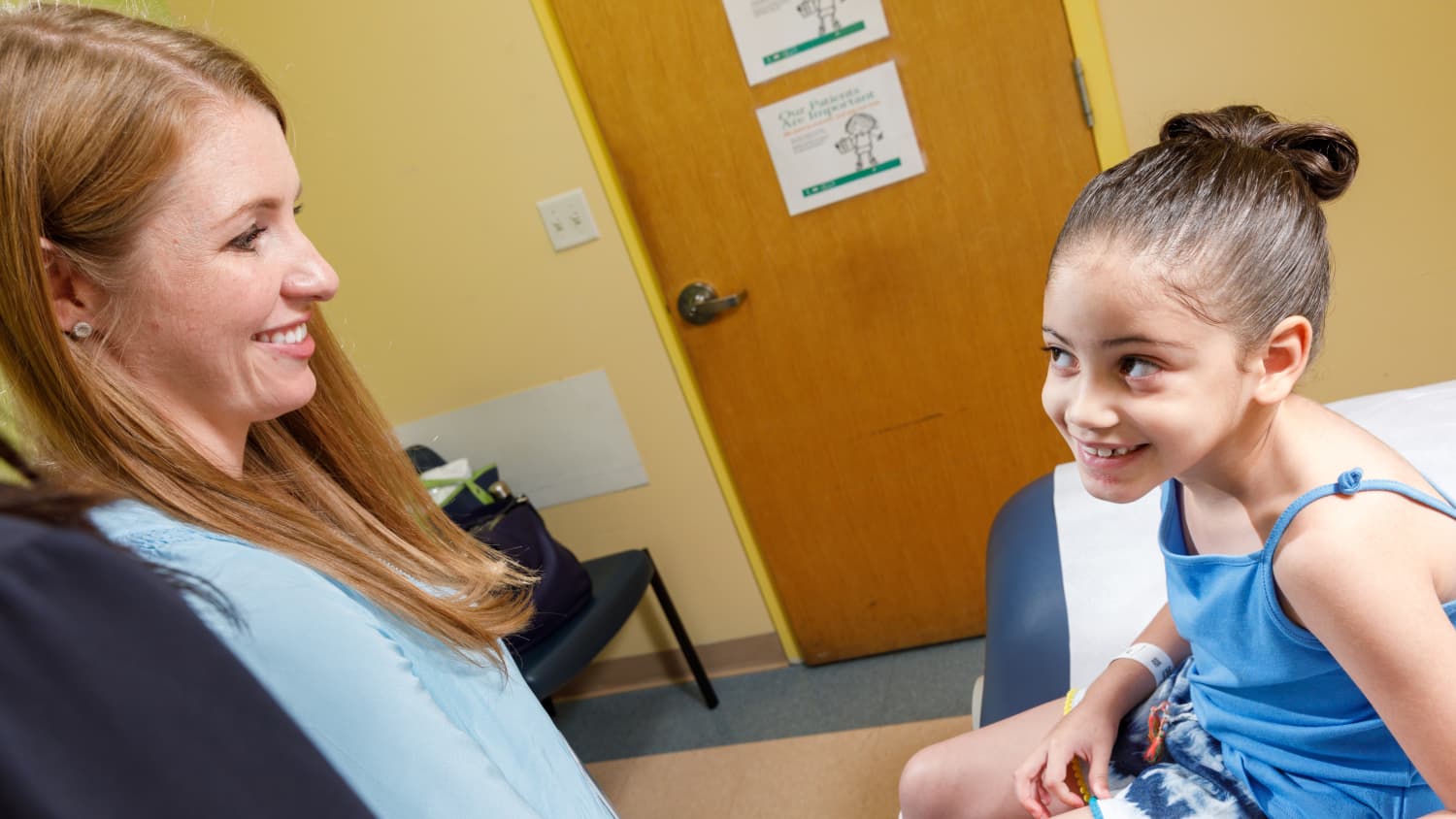 Kaityln Murphy PNP speaks with patient Makaila.