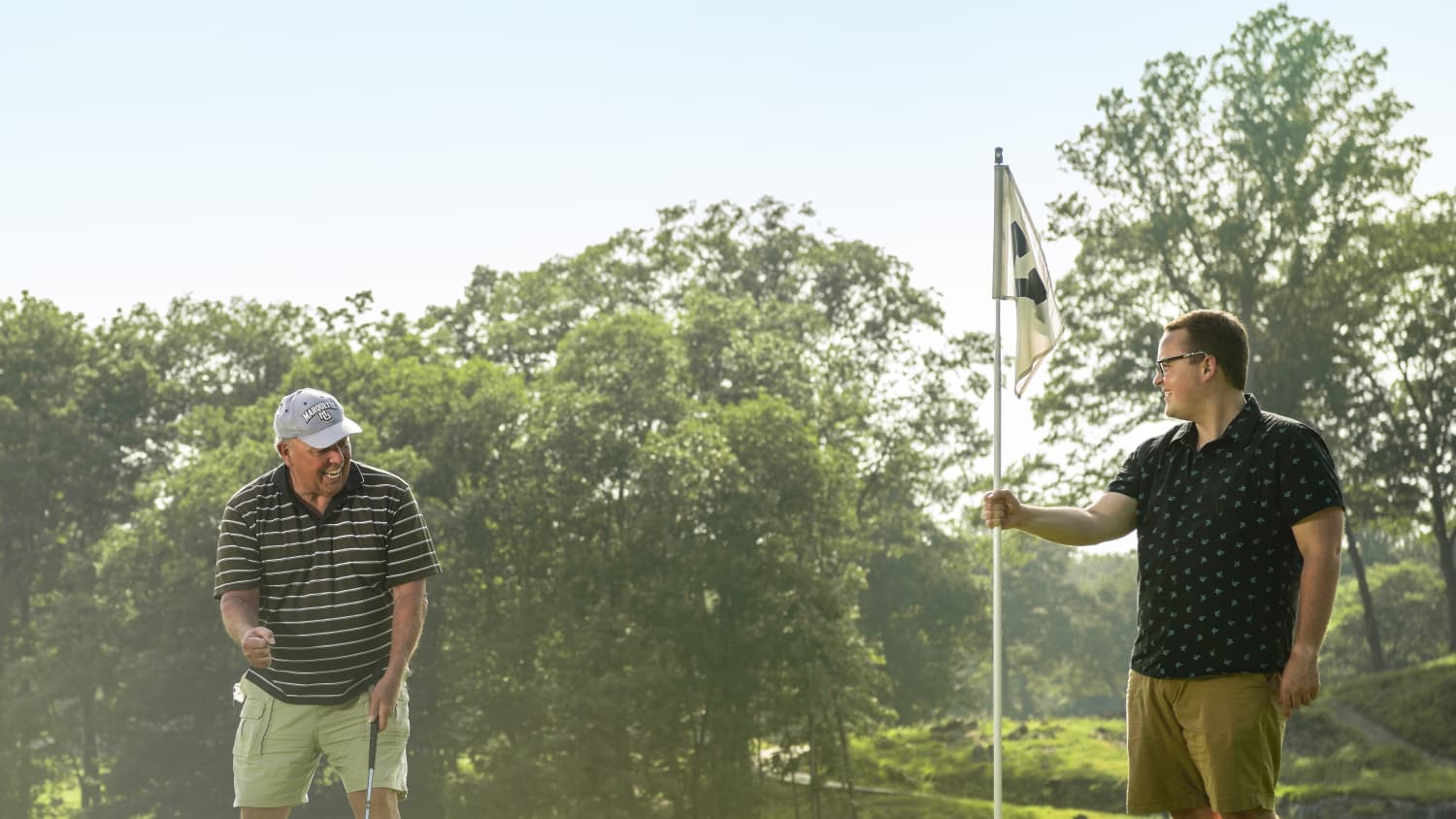 Joe golfing with son