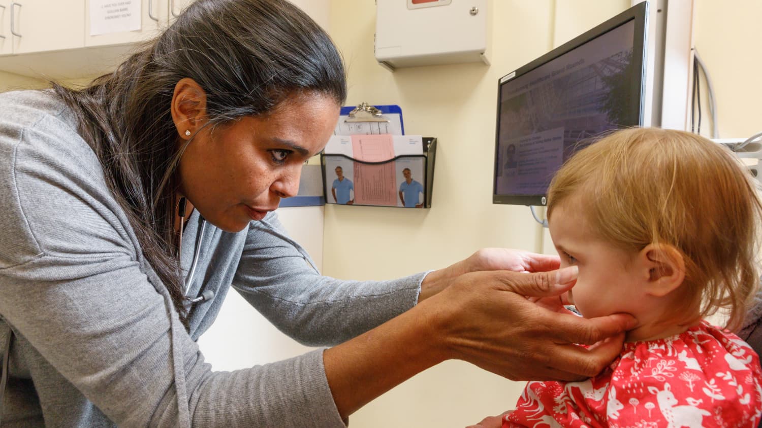 Dr. Cameron examines her young patient for signs of a congestion.