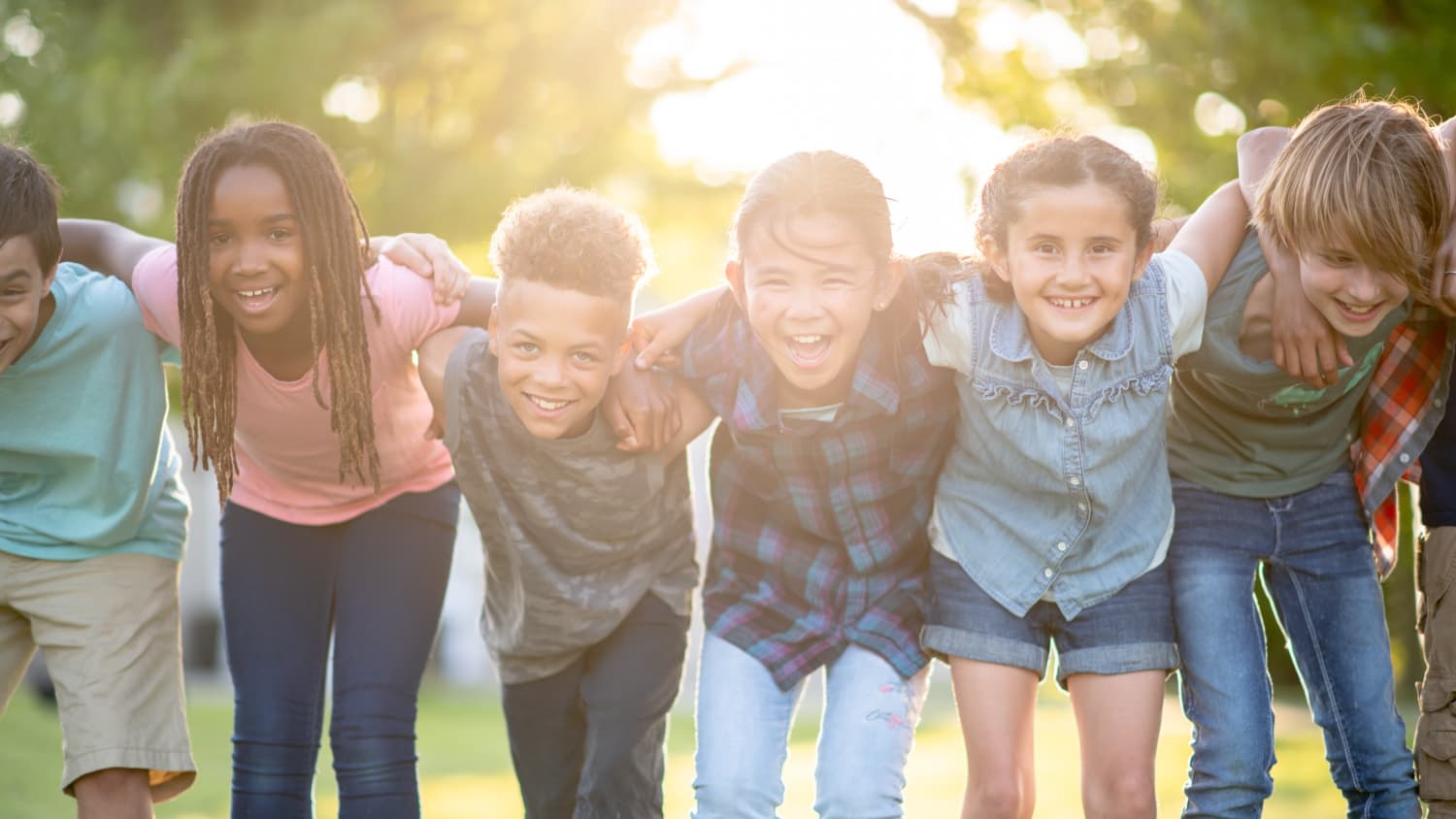 children with linked arms, playing after leukemia treatment