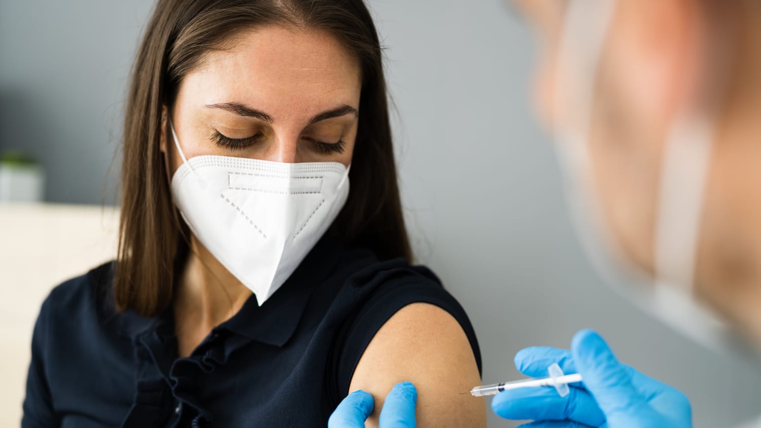 woman getting (possibly Novavax) COVID-19 vaccine