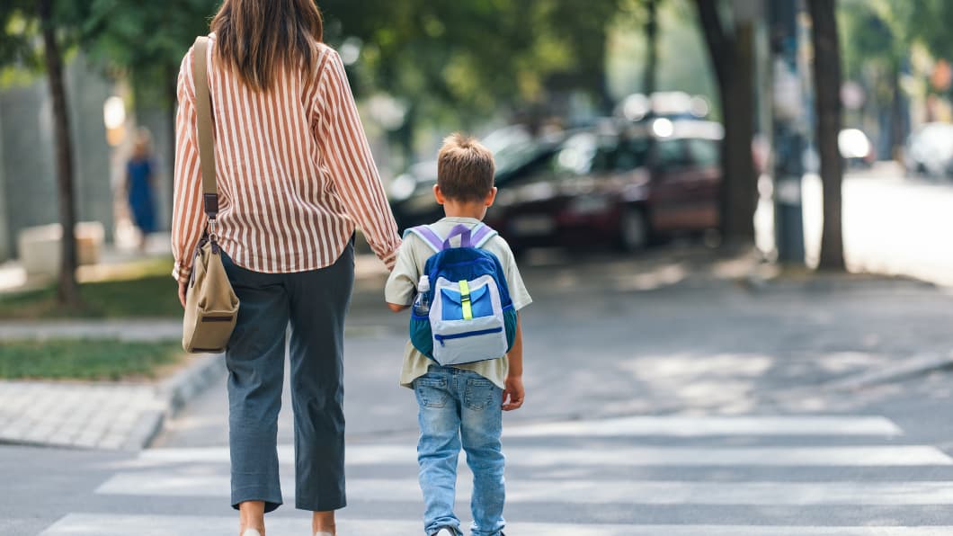 mother and son walking to school