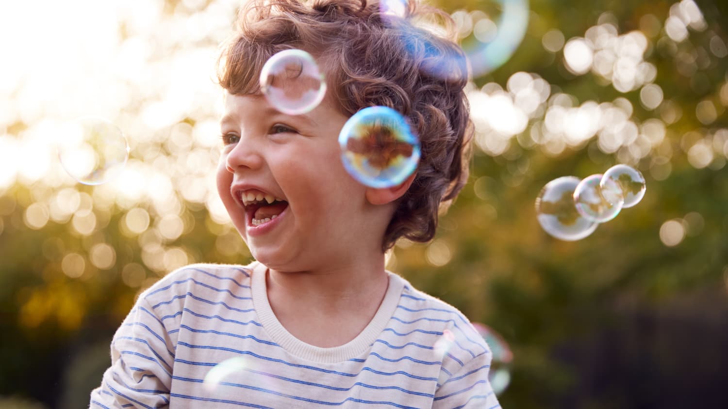 happy kid with bubbles after chemotherapy treatment