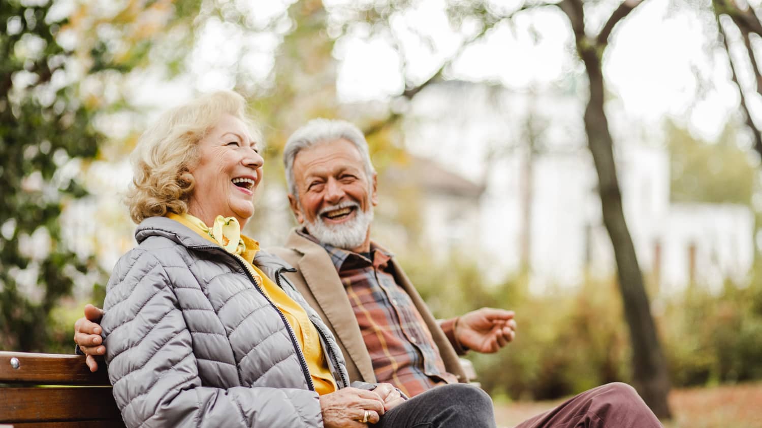 old couple on bench happy after lymphoma treatment