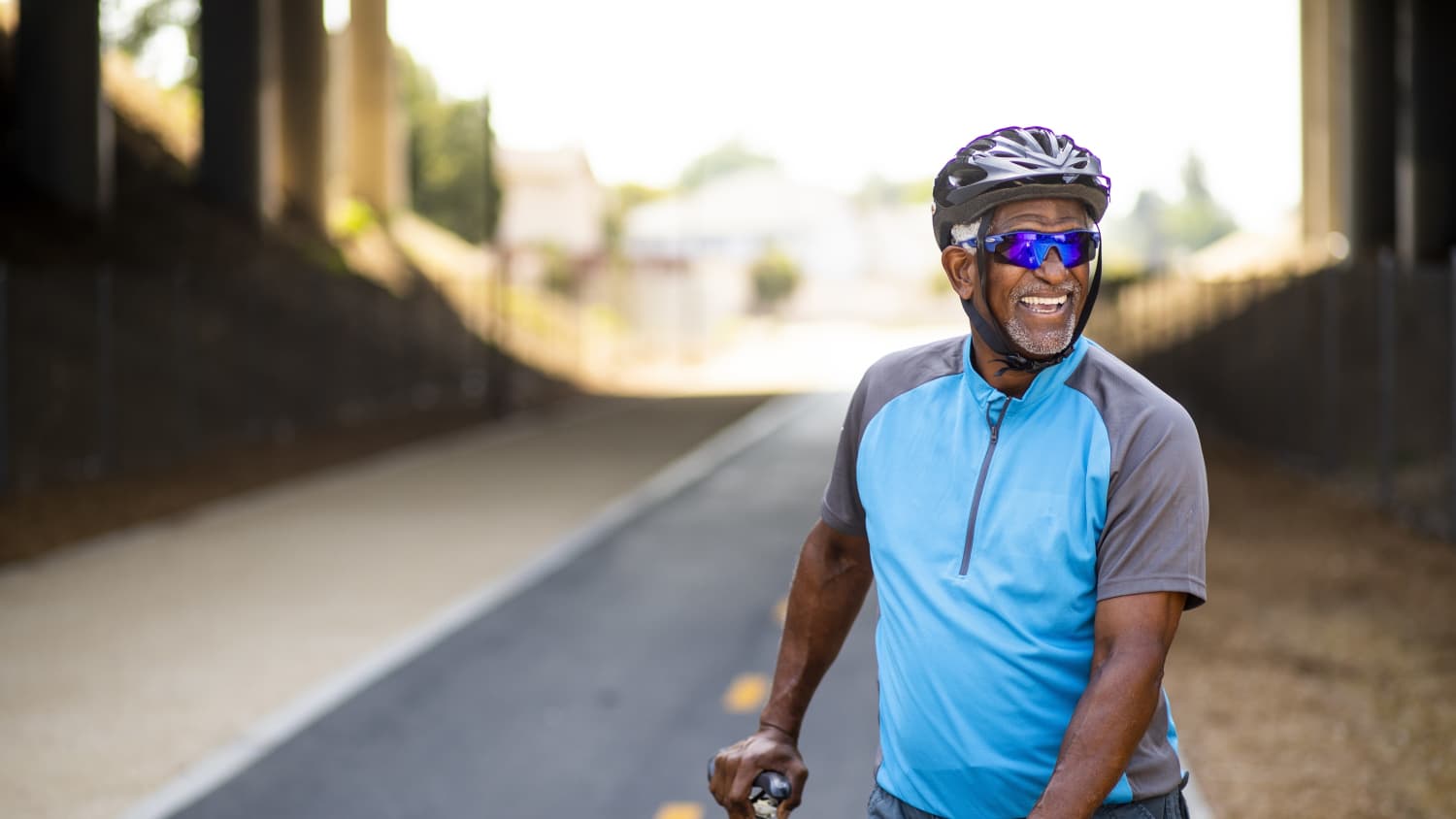 older man bicycling after treatment for esophageal cancer