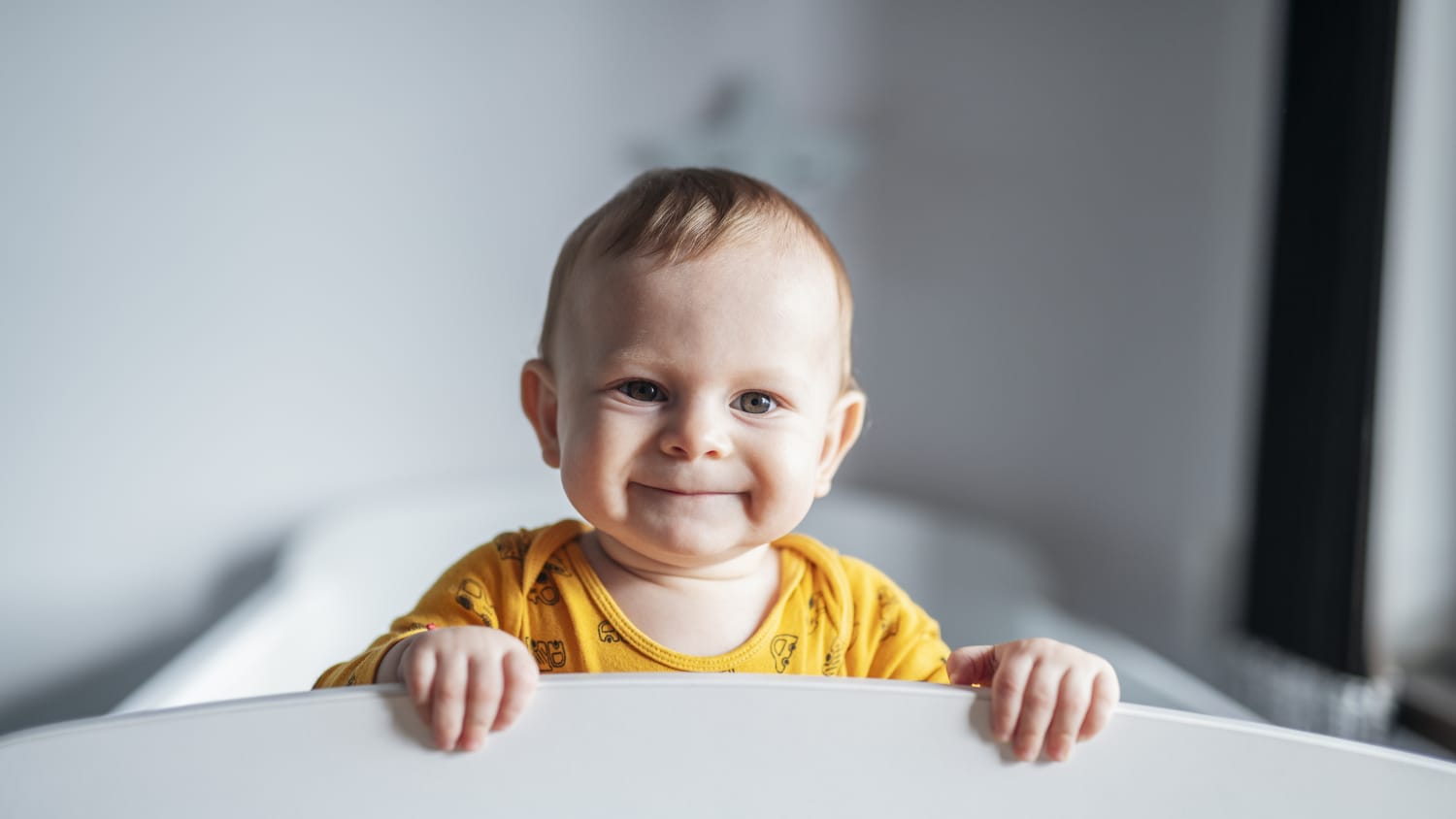 a baby with torticollis smiling