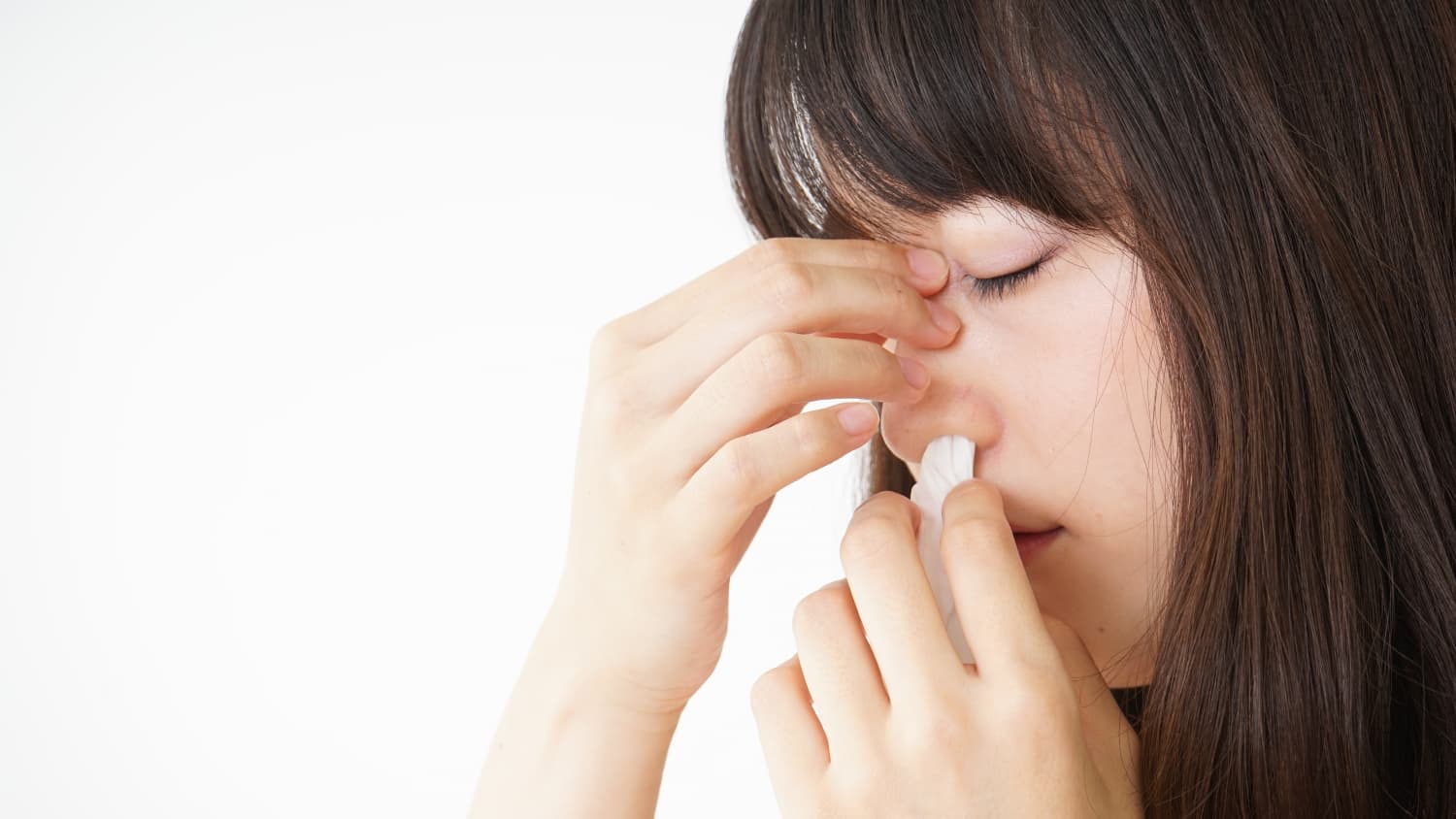 Young woman getting a bloody nose, perhaps because of HHT