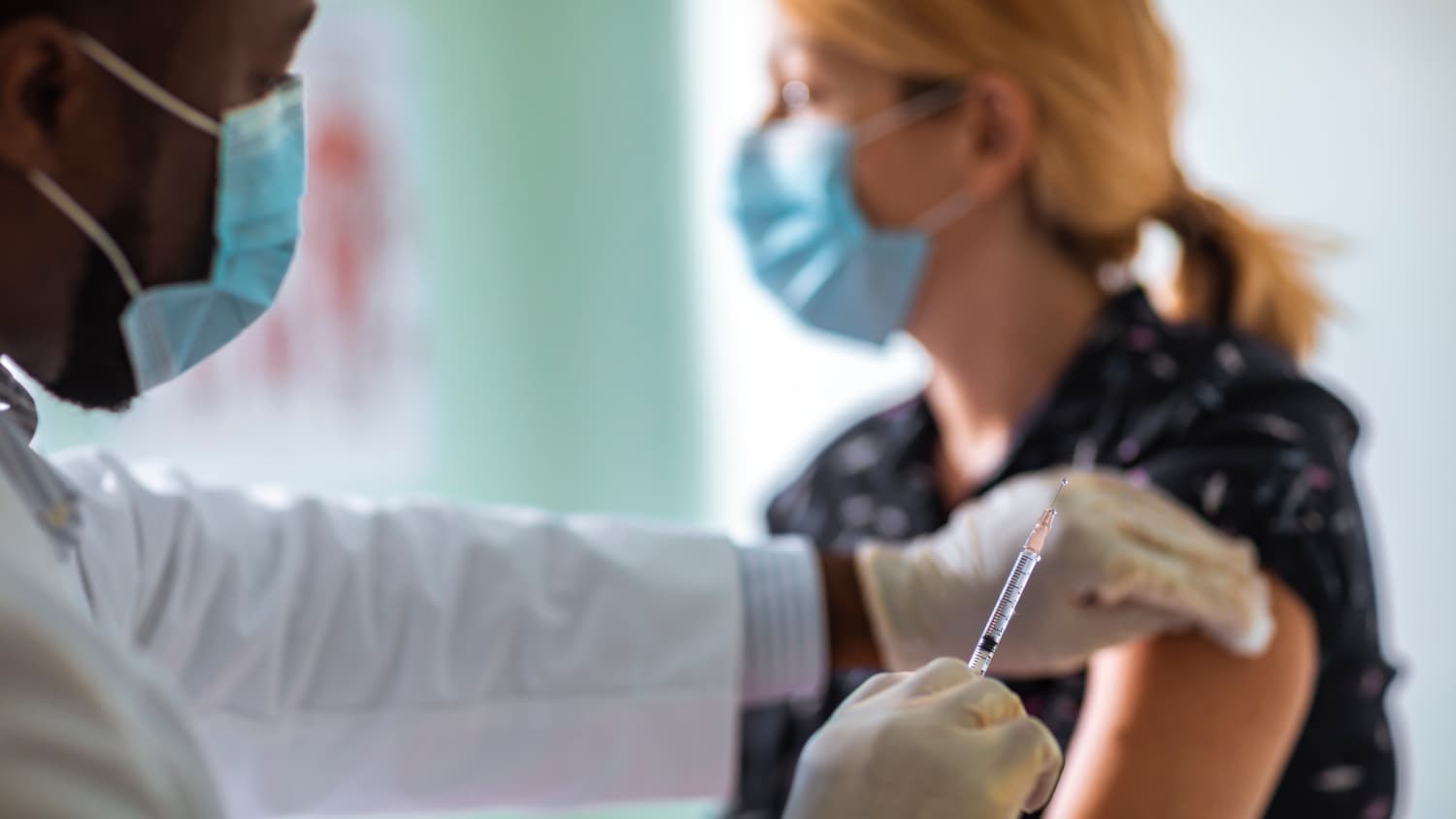 woman receiving a COVID-19 vaccine