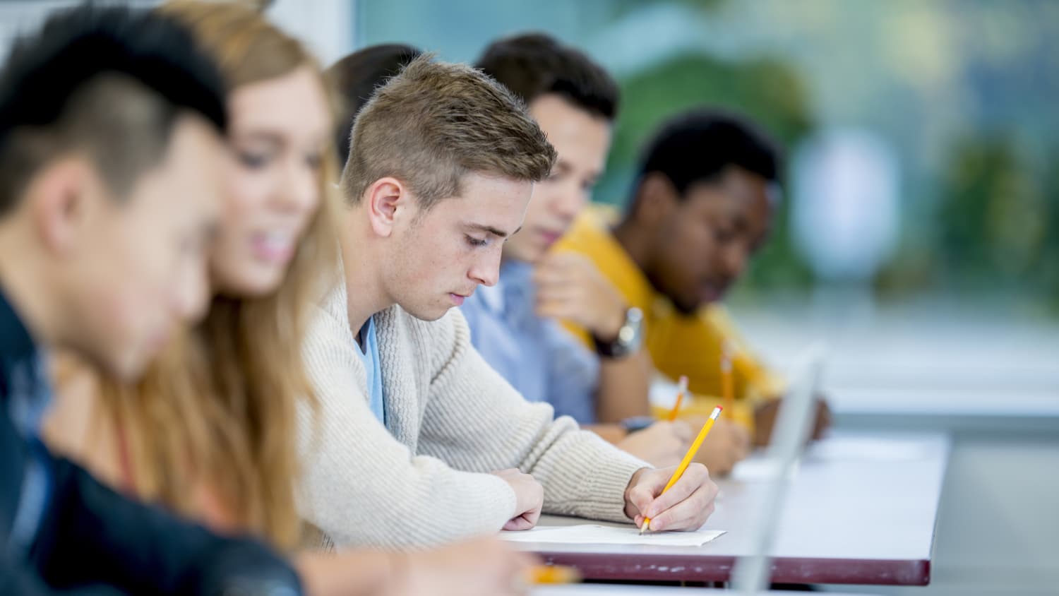 college kid taking an exam, while managing diabetes