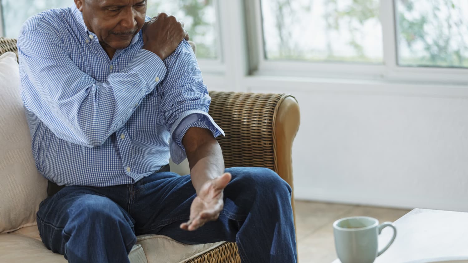 Man feels shoulder pain that may need shoulder surgery.