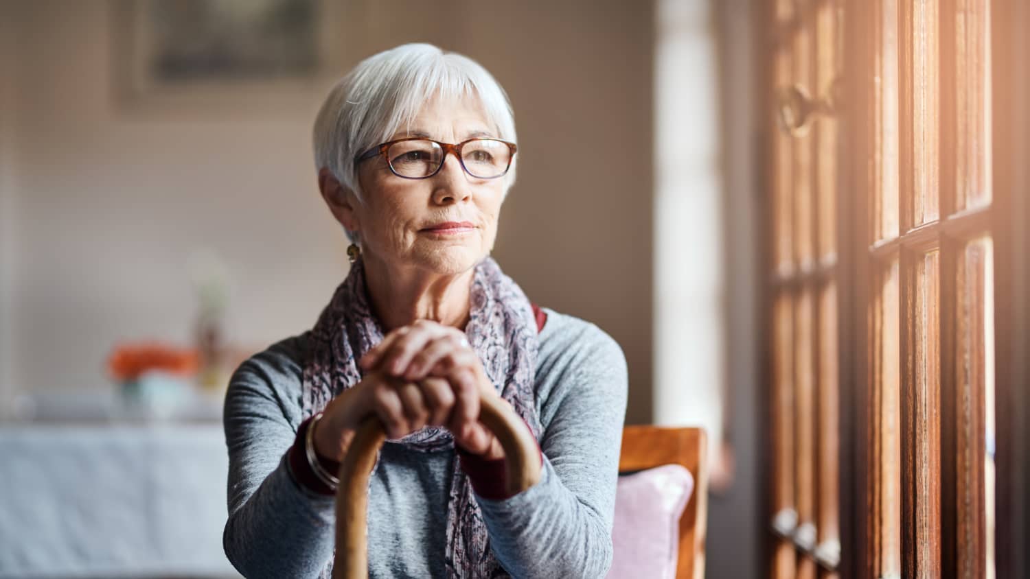 older woman looking out woman after receiving Radiofrequency Ablation (RFA)