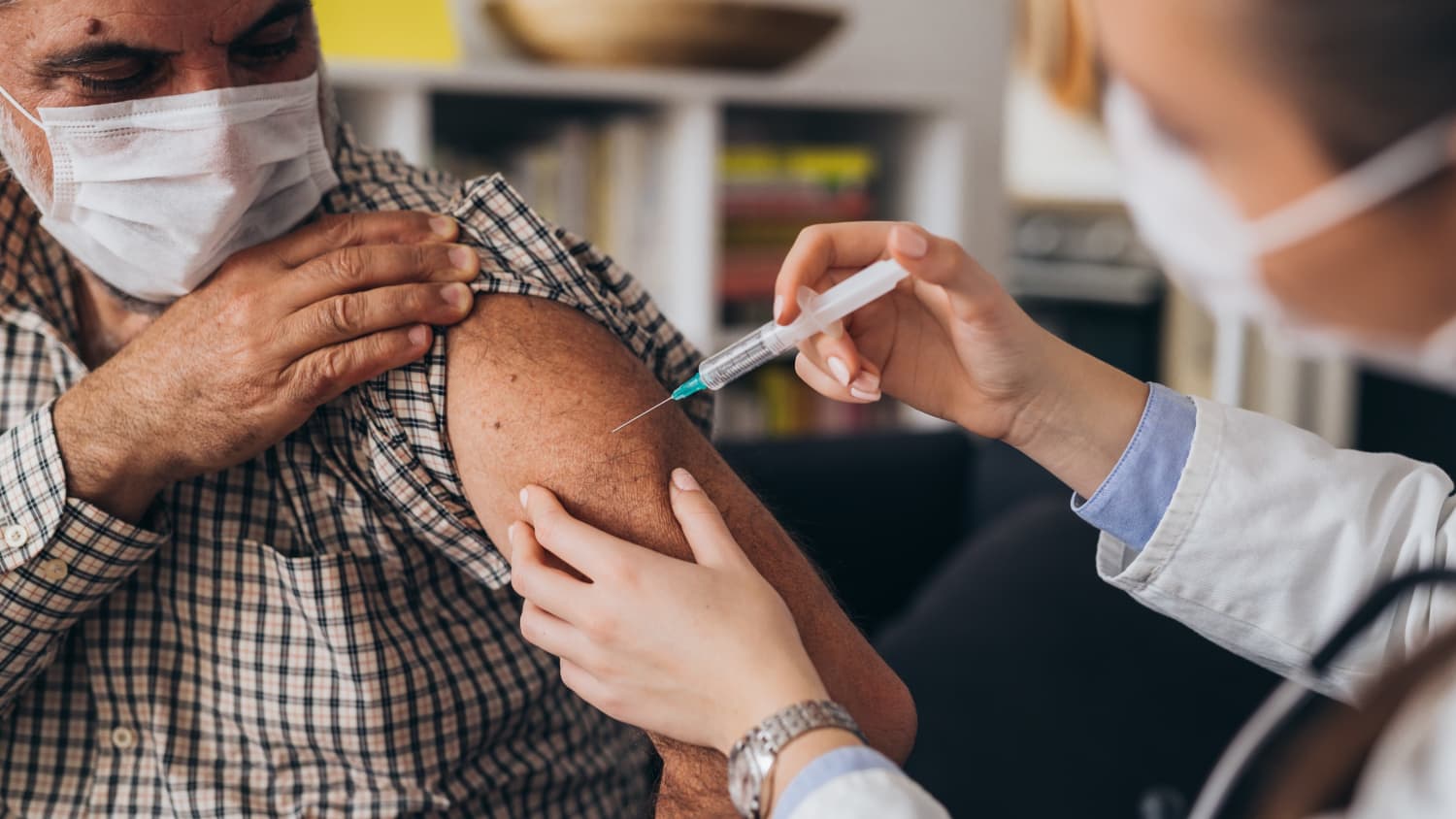 man receiving coronavirus vaccine